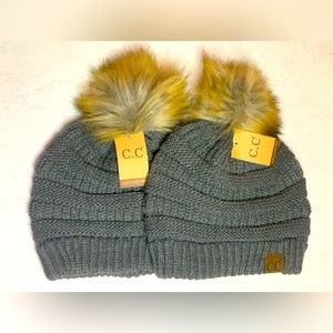 2 beanies with a puff